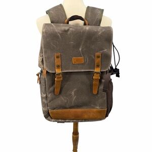 Waxed Canvas Brown Men's Backpack with Tan Accents.